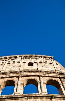 Colosseum in Rome with blue sky, landmark of the city