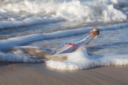 A message inside a glass bottle, washed up on a remote beach.