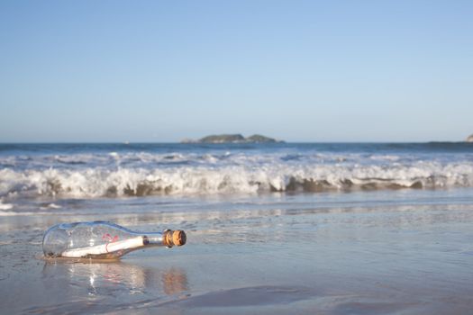 A message inside a glass bottle, washed up on a remote beach.