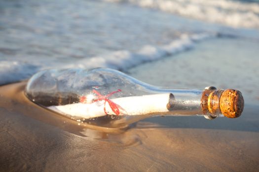 A message inside a glass bottle, washed up on a remote beach.