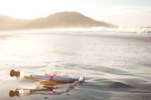 A message inside a glass bottle, washed up on a remote beach.