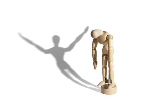 Sad wooden mannequin with happy shadow isolated in white background.