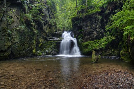 Shot of the fall of water. Stream Huntava - natural area - nature preserve.
Resov, Czech republic, Europe.
