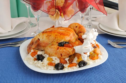 Grilled Chicken with rice and dried fruit on the dining table