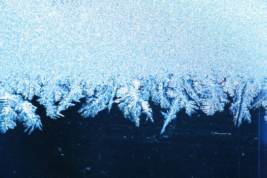 The patterns made by the frost on the window (hoarfrost background)