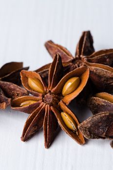 Close up few star anise on white wooden table