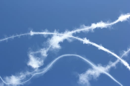 lines of smoke over the sky after an airplane demonstration