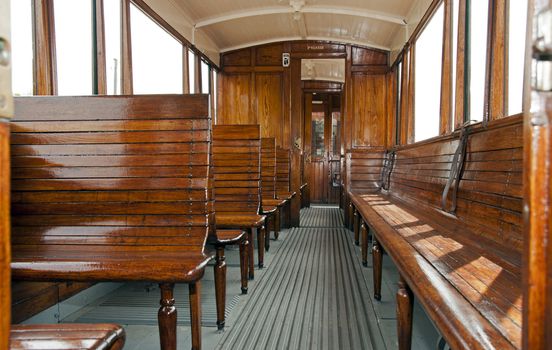 old wooden train interior with view trought the windows