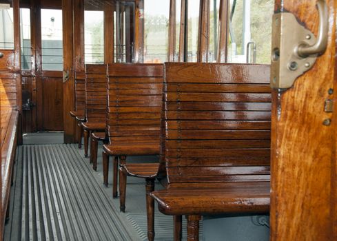 old wooden train interior with view trought the windows