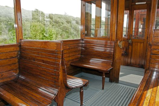 old wooden train interior with view trought the windows