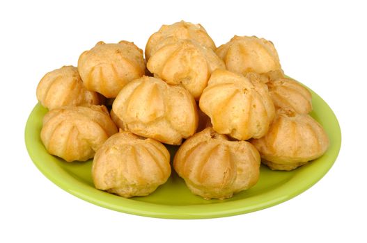 profiteroles on a plate isolated on white background