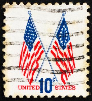UNITED STATES OF AMERICA - CIRCA 1973: a stamp printed in the USA shows 50-Star and 13-Star Flags, circa 1973