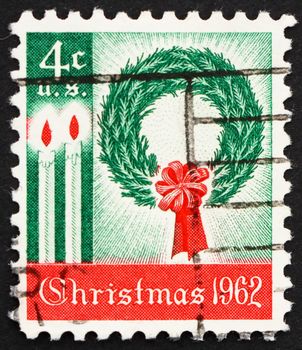 UNITED STATES OF AMERICA - CIRCA 1962: a stamp printed in the USA shows Wreath and Candles, Christmas, circa 1962