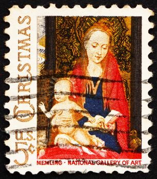 UNITED STATES OF AMERICA - CIRCA 1966: a stamp printed in the USA shows Detail from Painting Madonna and Child with Angels by Hans Memling, Christmas, circa 1966