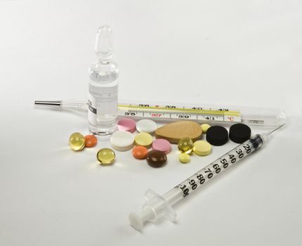 syringe and thermometer with medication