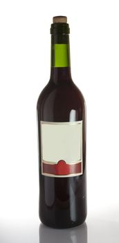 A bottle of red wine with a blank label, isolated on white with clipping path.