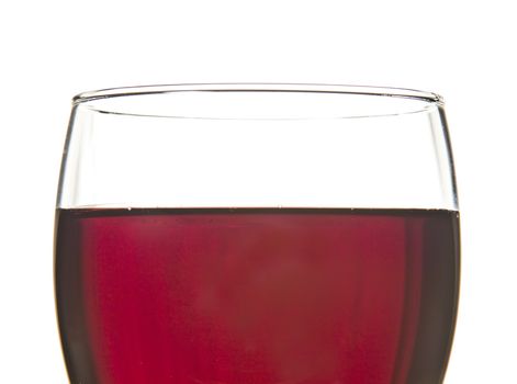 Closeup of a glass of red wine, with white background.
