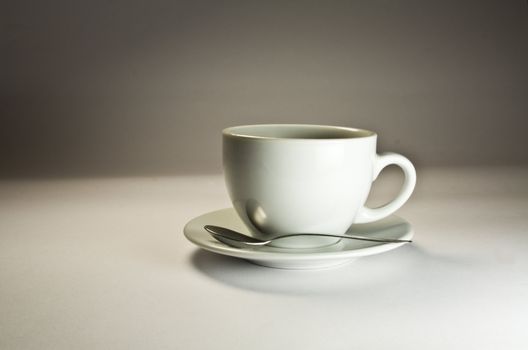 Coffee cup on a grey background. Studio