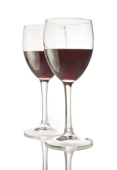 Two wineglasses filled with red wine, isolated on white with clipping path