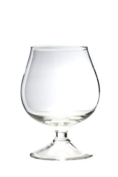 Empty cognac glass on white background
