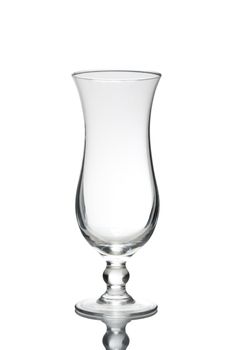 Empty cocktail glass on white ground