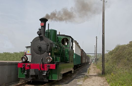 old green steam train in Holland