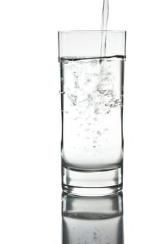 mineral water being poured into a glass
