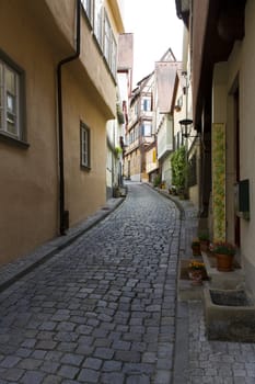 narrow lane in historic city in south west germany with bouldering