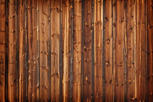 A fence made of old larch boards - grunge background