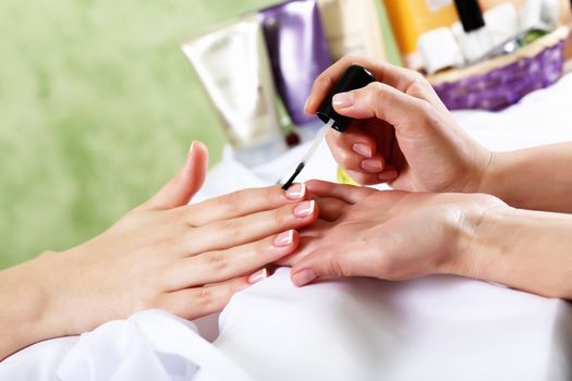 Female hands and manicure related objects in spa salon