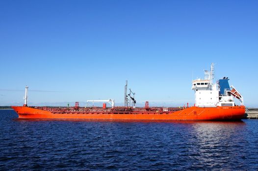 The tanker is moored in the port and loaded fuel