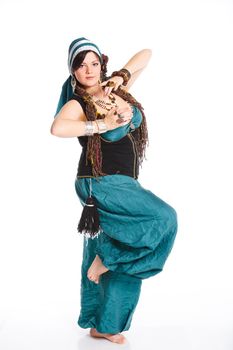 Oriental dancer in blue costume over white background