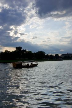 Boat on the river at sunset in Krakow