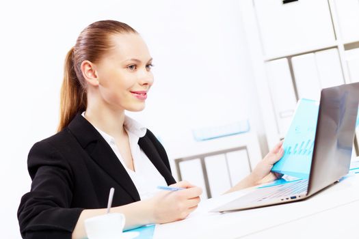 Business woman working on computer in office