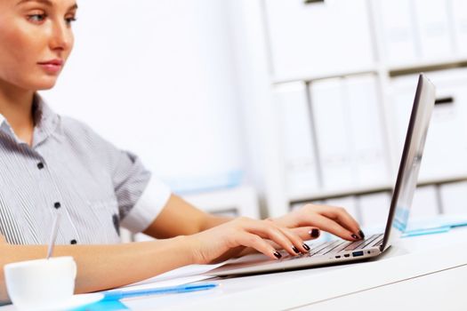 Business woman working on computer in office