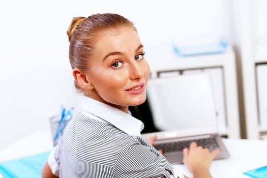 Business woman working on computer in office