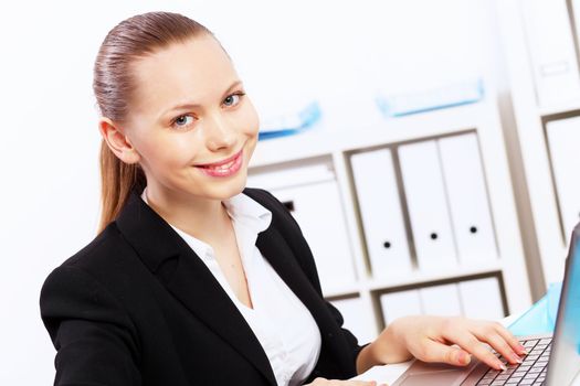 Business woman working on computer in office