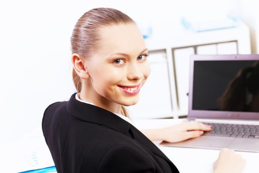 Business woman working on computer in office