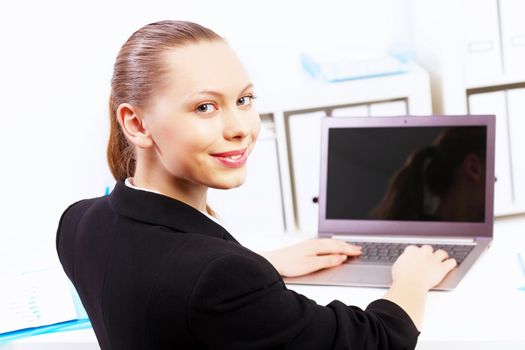 Business woman working on computer in office