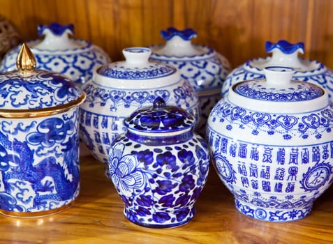 chinese antique vase on the wood background