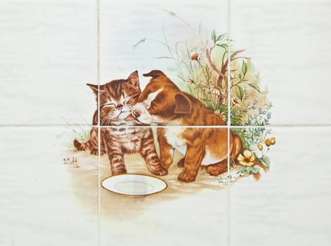 decorative tile with dog and cat design
