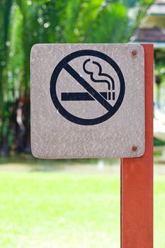 no smoking metal sign in the park
