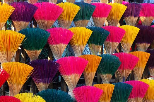 Colorful incense or joss sticks for buddhist prayers in Vietnam 