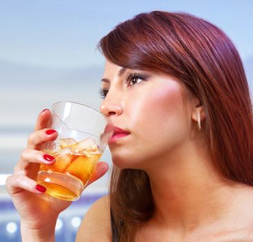 beautiful woman with glass of whisky