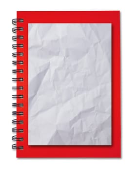 Crumpled paper on red notebook