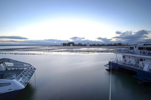 Sunset on the Tejo river with Barreiro mills in background.