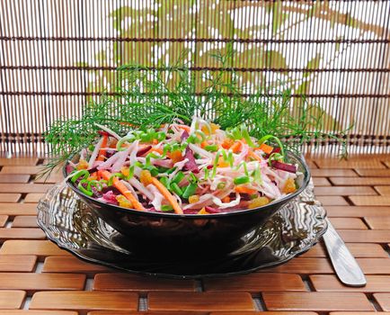Cabbage salad with beets, carrots, raisins and herbs

