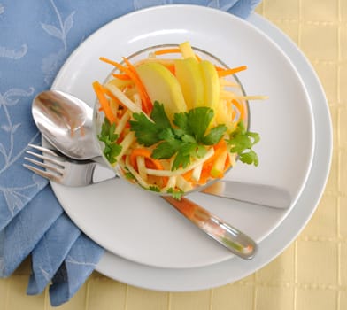 Salad of celery root and leaves with carrots, apples and shrimp