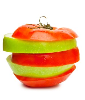 Sections of fresh ripe green apple and red tomato isolated over white background. Diet concept