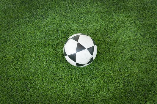 Black and white soccer ball on Artificial turf football field
